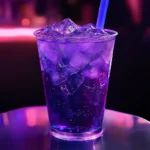 Taco Bell Baja Midnight 2025: Make The Crunchwrap & Dirty Baja 8 Taco Bell Baja Midnight drink in neon purple glass