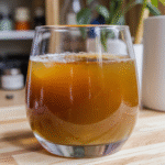 homemade baking soda trick drink with lemon, turmeric, and sea salt on a rustic table